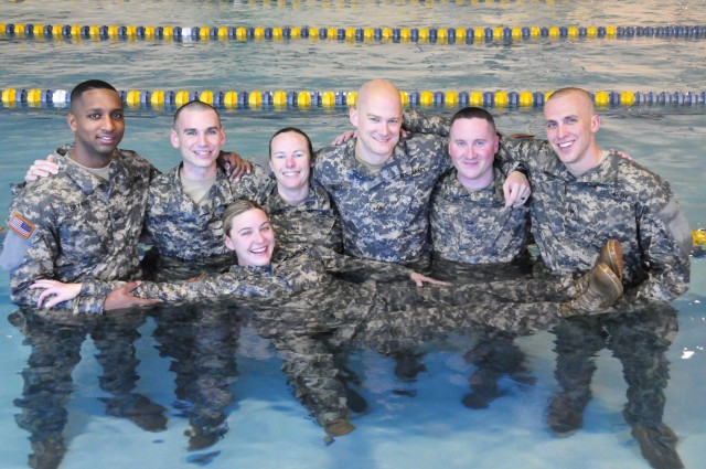 Candidates conduct water survival training