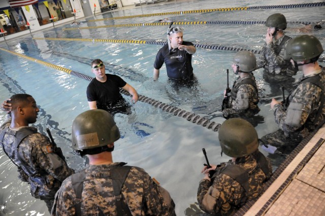 Candidates conduct water survival training
