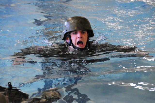 Candidates conduct water survival training