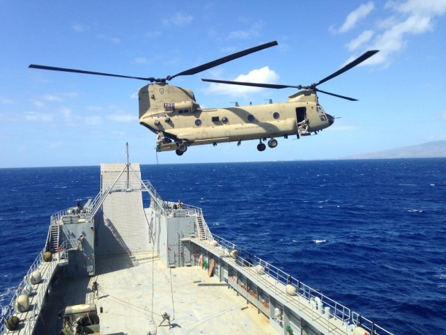 Pacific Waterborne, Air Assault, Aviation Soldiers work together during maritime rappel/sling load operations