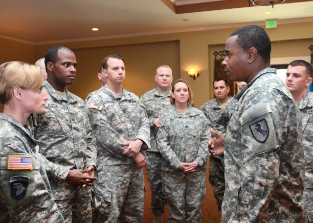 Assistant instructor, Sgt. 1st Class Christopher Flagg, speaks to graduates of Battle Staff Non-commissioned Officer Course 06-15