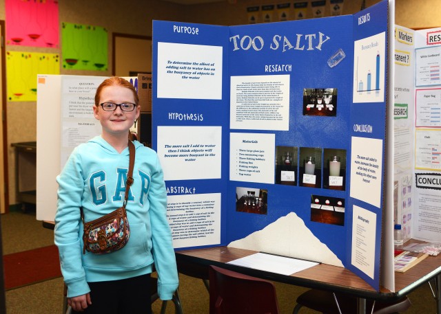 Fifth grade student, Madison Burke -- 11 and in Briarly Mayeda's fifth grade class -- stands to the side of her project called,