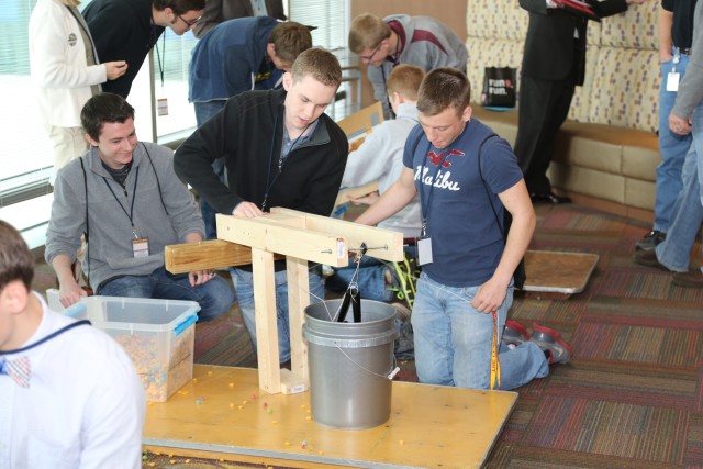 Students work to remove simulated debris into empty resevoir.  