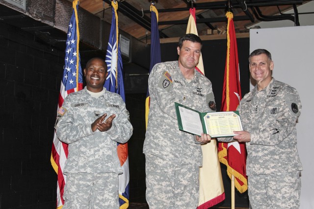 Mann, Sadler present award to USAG-KA Department of Logistics