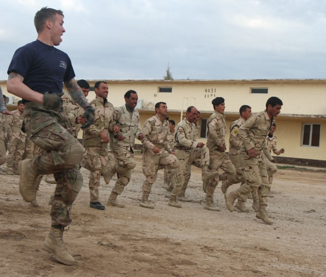 Iraqi soldiers perform physical training with 82nd Airborne