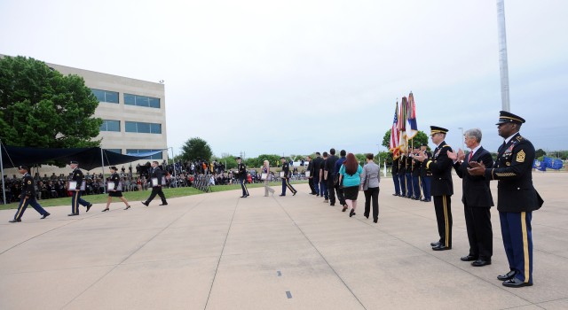 Fort Hood presents Purple Hearts, medals to shooting victims, Families