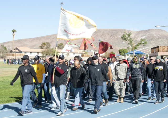 The 1916th Support Battalion, led by Lt. Col. Marshanna Gipson, walks at the start of Demin Day