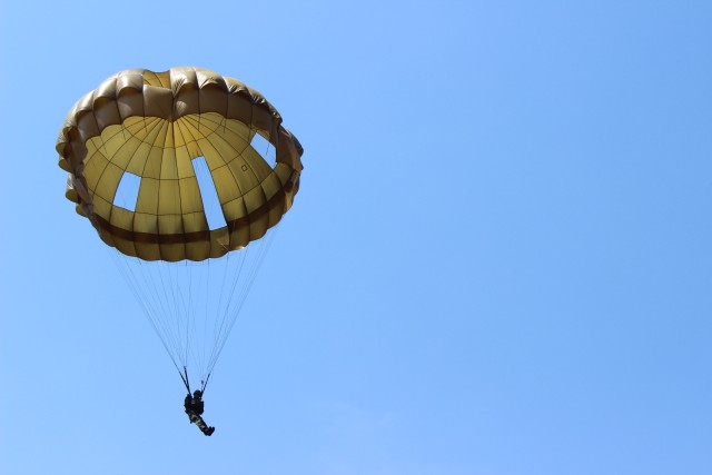 Japanese Paratrooper readies to land