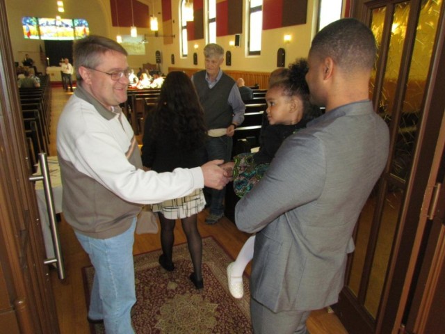 Greeting the churchgoers