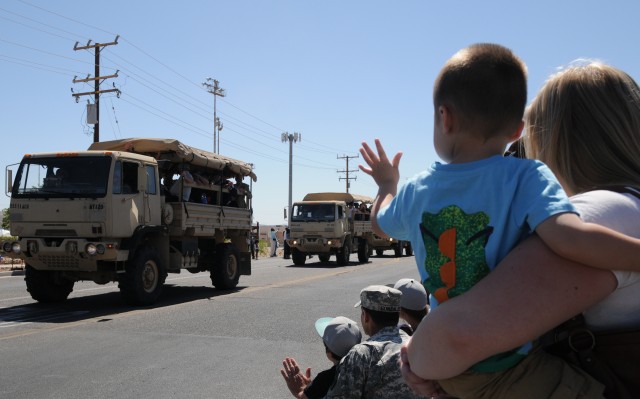 A Fort Irwin family waves to Vietnam Veterans