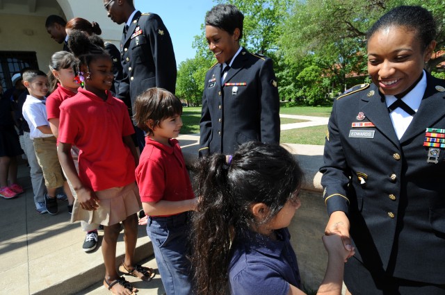 Soldier Show cast members meet and greet Camelot Elementary School students