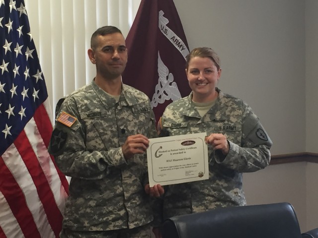 Maj. Giorio and Lt. Col. Misigoy pose after Maj. Gioro was recognized for patient safety