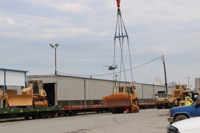 25th ID heavy equipment is loaded onto railcars at the Port of Beaumont, Texas.