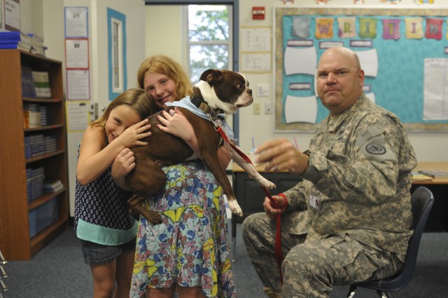 3rd Cav trooper volunteers with 'Buster the Tank Dog'