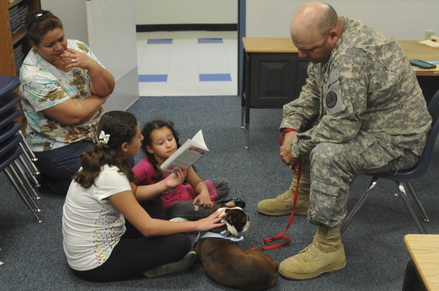3rd Cav trooper volunteers with 'Buster the Tank Dog'