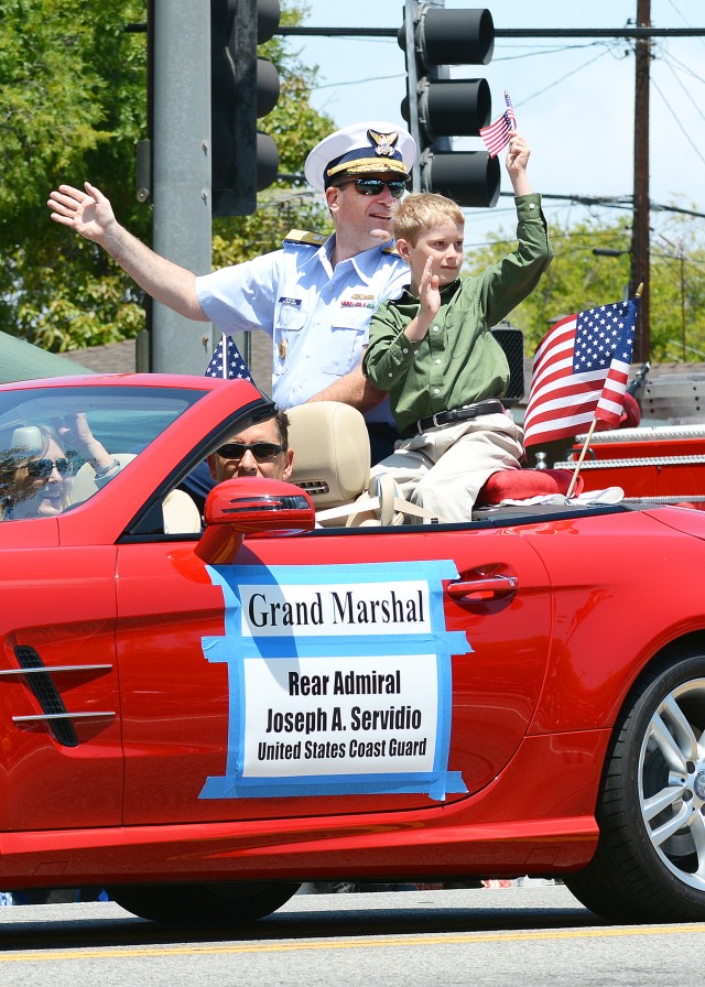 Coast Guard Rear Admiral Joseph Sirvidio rides in 2015 Torrance Armed Forces Day Parade