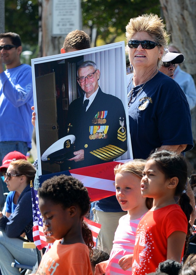 Sharynn McGee holds photo of her dad, Command Master Chief Richard McGee