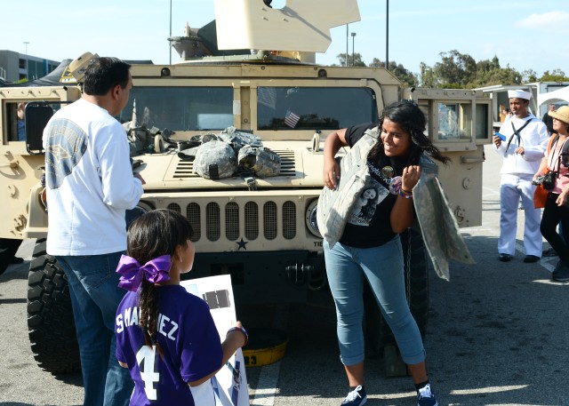 Girl tries on interceptor body armor