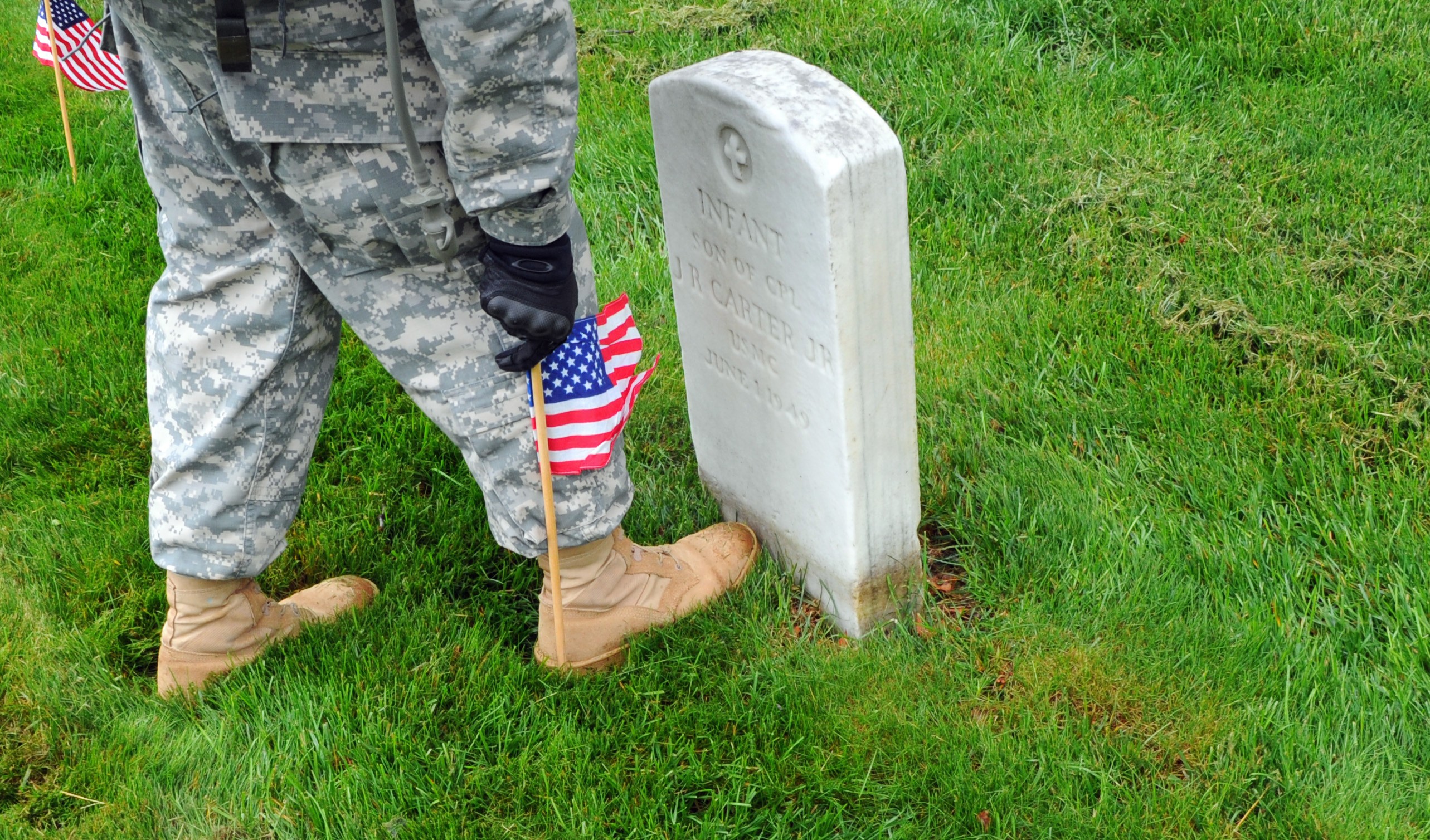 Soldiers participate during Flags In at Arlington Cemetery Article