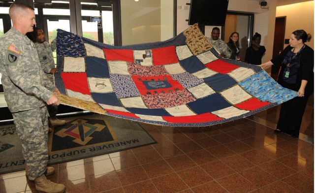 Middle school students dedicate quilt to fallen