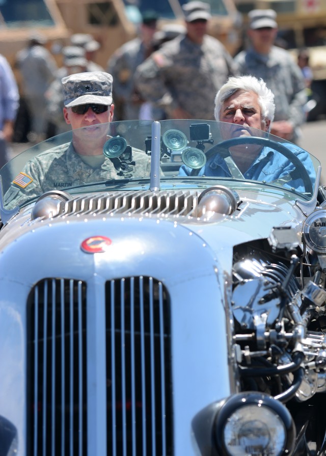 National Training Center and Fort Irwin Commander Brig. Gen. Joseph Martin and Jay Leno drive off