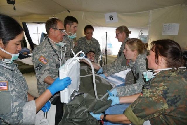 EMT personnel transferring patients to the ICU