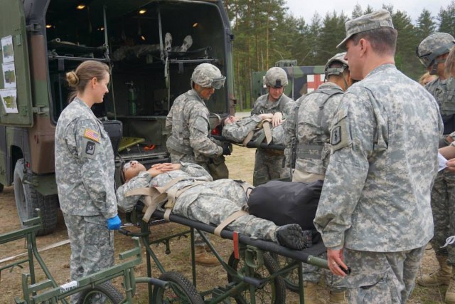 EMT unloading casualties from the FLA