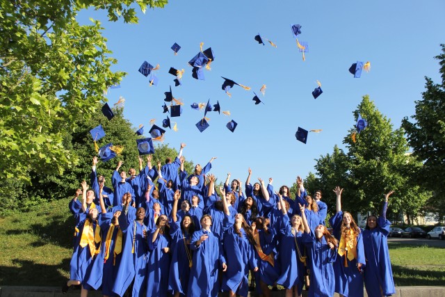 Mortarboards in air