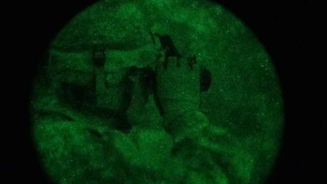 Soldier adjusts NGVs ahead of night air assault