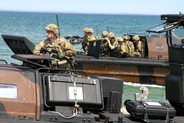 Army paratroopers take beach during exercise