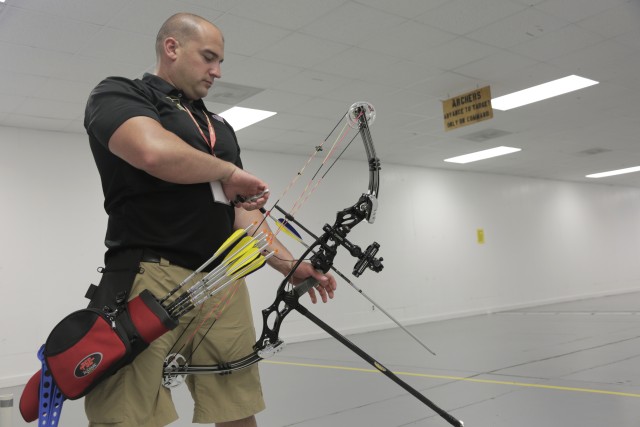 U.S. Army Reserve Capt. Joe Colon Jr. prepares to shoot during archery training for the 2015 DoDWarrior Games