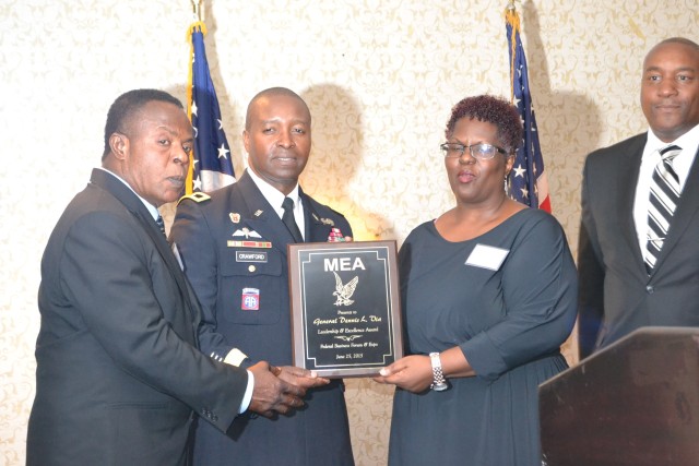 CECOM Commanding General accepts leadership award on behalf of Gen. Dennis Via