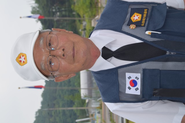 Korean war veteran poses for photo