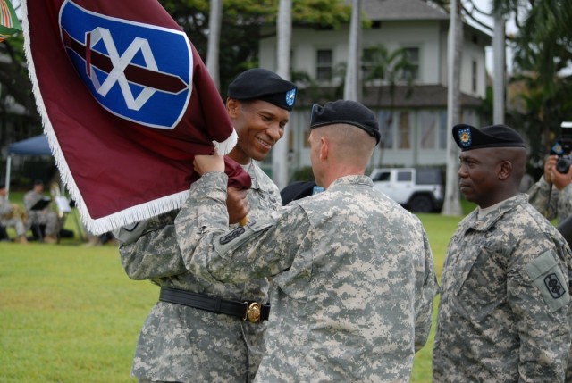 Col. Ackermann passes the 18th MEDCOM colors to Brig. Gen. Sargent