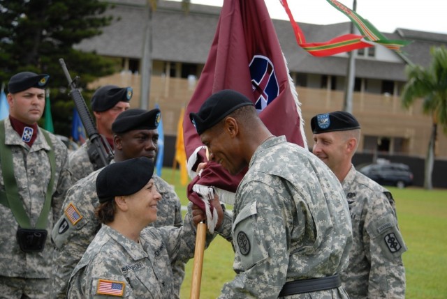 Brig. Gen. Sargent passes the 18th MEDCOM (DS) colors to Col. Sammartino