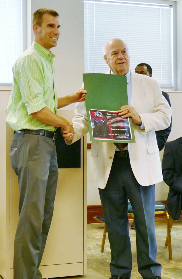 SED engineer, Robert Kennedy receives the "Take a Bow" award from Dr. William Craig at the SED Awards Program.