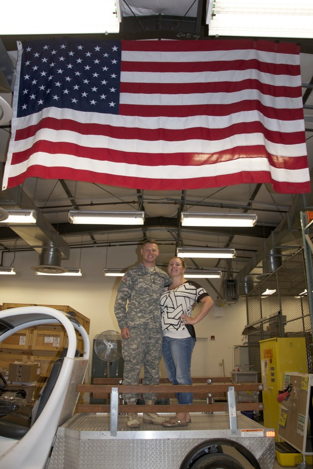 Unable to bring the flag to a Soldier reenlistment, hospital colleagues bring Soldier to flag..