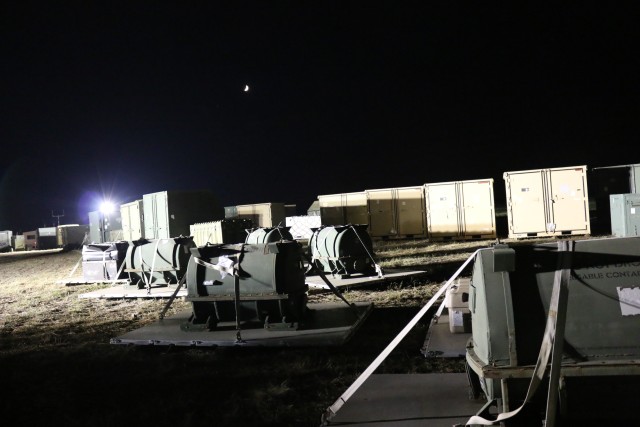 Working through the night, the cargo yard begins to fill.
