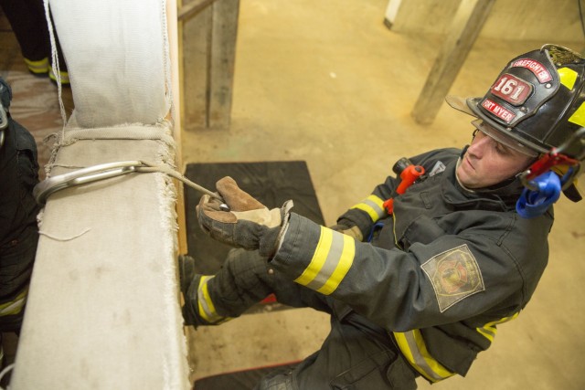 Hooks in: Local firefighters train to rappel from danger