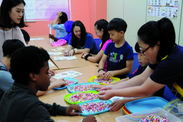 American and Korean children become friends at the Korean-American Joint Summer School
