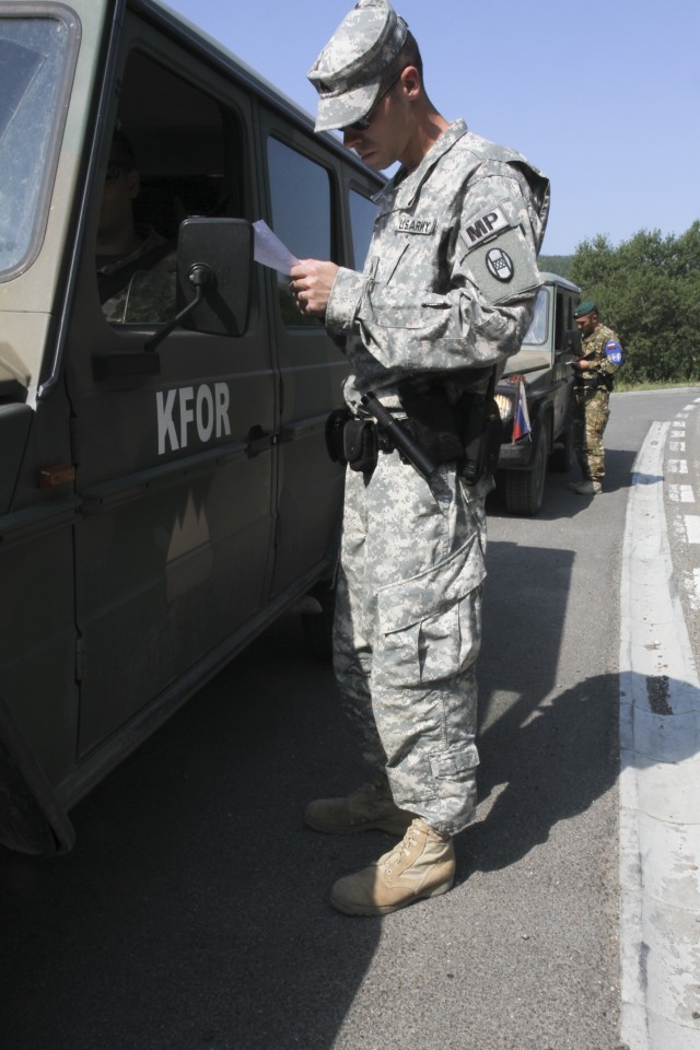 Military police from around the world hold joint traffic control point inspections