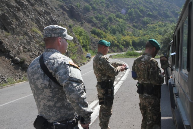 Military police from around the world hold joint traffic control point inspections