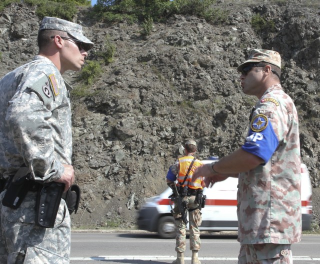 Military police from around the world hold joint traffic control point inspections