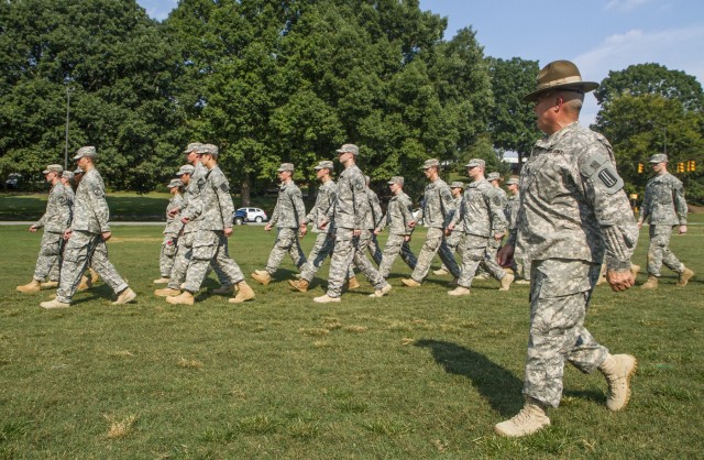 98th Division drill sergeant marches a formation of cadets