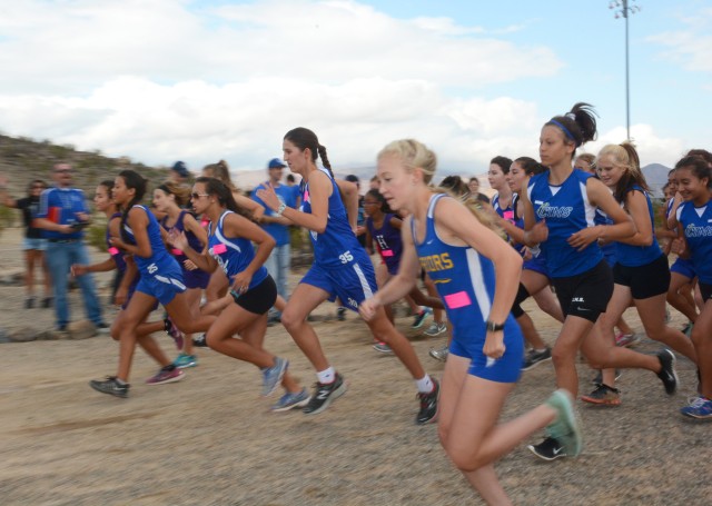 Female cross country runners start race