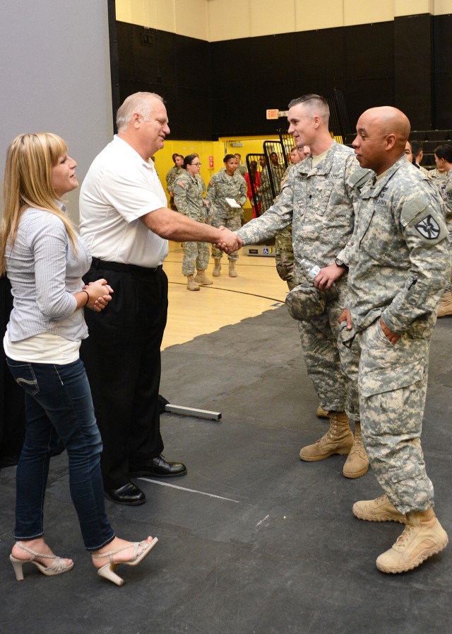Eric Hipple and daughter Tarah Hipple greet Fort Irwin Soldiers