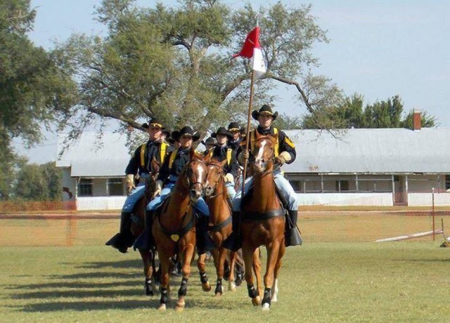 First Team's horse detachment maneuvers past competition