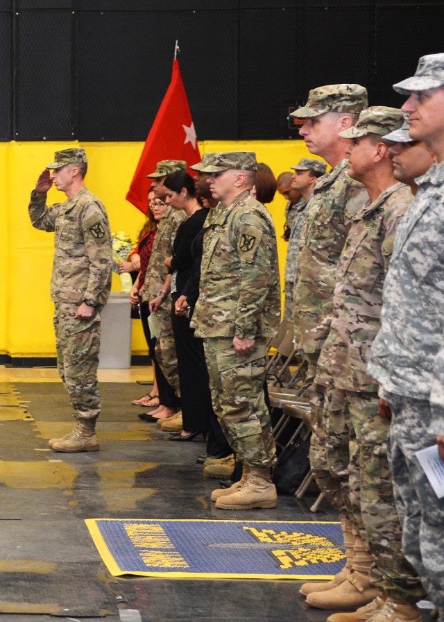 LTC William Garber salutes at deployment ceremony
