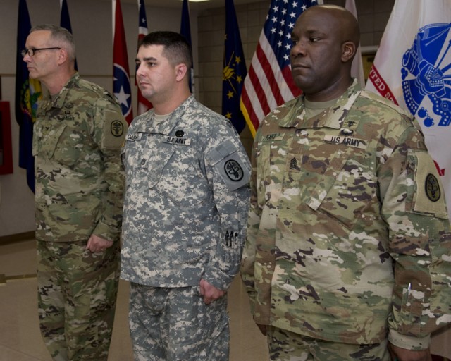 Army Staff Sgt. Michael Caruso (center) as the ceremony that will award him a Purple Heart medal begins