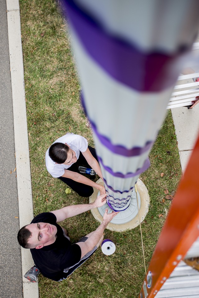 Volunteers color JBM-HH purple for domestic violence awareness